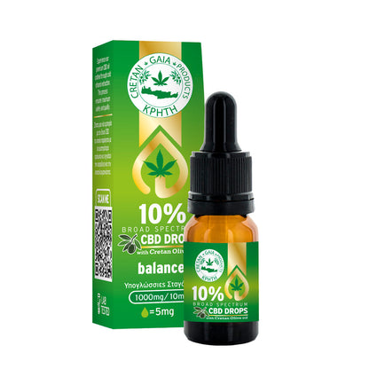 CBD oil dropper bottle with amber liquid, green label, and matching green box